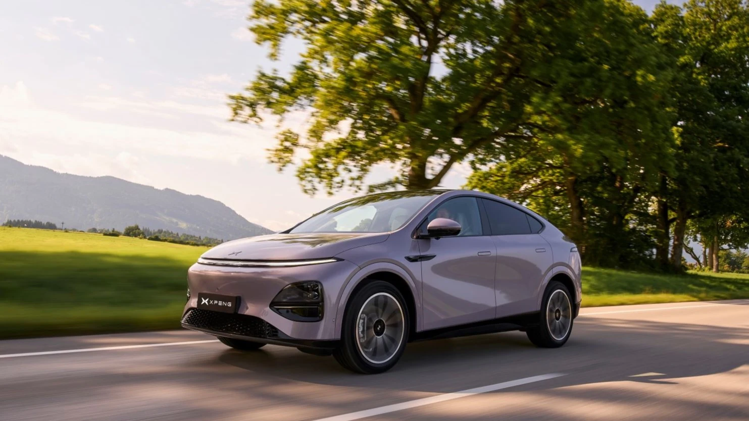 New XPENG G6 in the official UK 2026 launch photograph, driving on a country road
